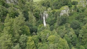 Aerial orbit clip of Llanrhaeadr-ym-Mochnant, Pistyll Rhaeadr natural Waterfall in North Wales, Oswestry, Powys, Wales