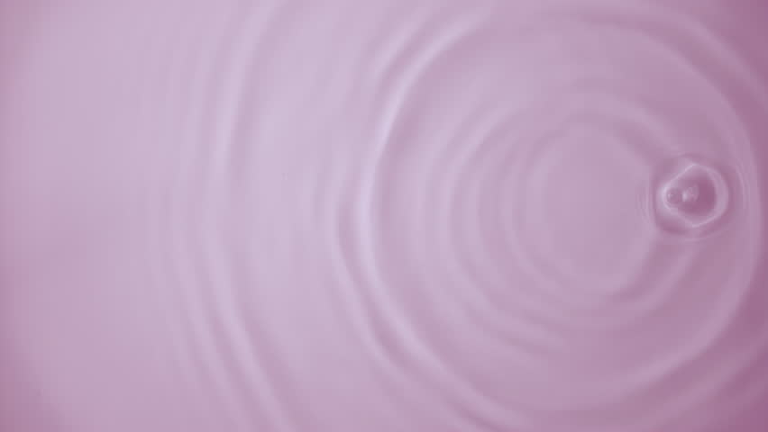 Beautiful closeup splash pink serum drop on rose background from above. Slow motion rings and ripple top view. Cosmetic beauty essence serum falling in slow motion. Body moisturizing cosmetics | Shutterstock HD Video #1111902599