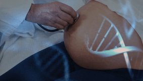 Dna strands over diverse male doctor listening with stethoscope to pregnant belly of patient. Pregnancy, check up, technology, genetics, medical services and healthcare digitally generated video.
