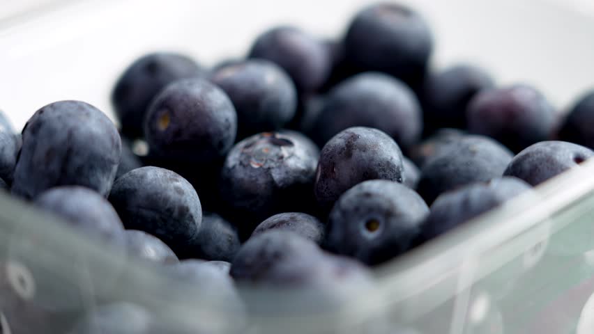 Set of fresh purchased blueberries in a plastic pack close up. Food from the supermarket Royalty-Free Stock Footage #1111915653