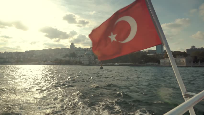 Istanbul Red Turkish Symbol Flag On Wind. Turkish Flag On Side Of Boat Bosphorus. Tourist On Boat Ship In Wind In Istanbul. Vivid Red Turkish Flag Flutter On Wind Against, Stern Of Ferry Boat Istanbul | Shutterstock HD Video #1111916157