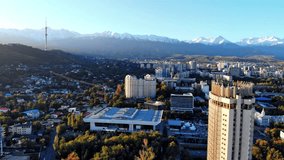 Hotel Kazakhstan and view of the Almaty mountains from the air.