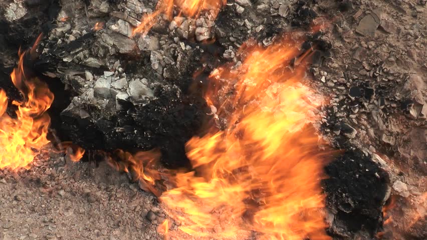 Ecology, global warming. Fire. Flames of burning gas from the surface of the earth. Fire flame roaring gas burning outdoors. Environmental pollution concept. Environment catastrophe on earth | Shutterstock HD Video #1111919943