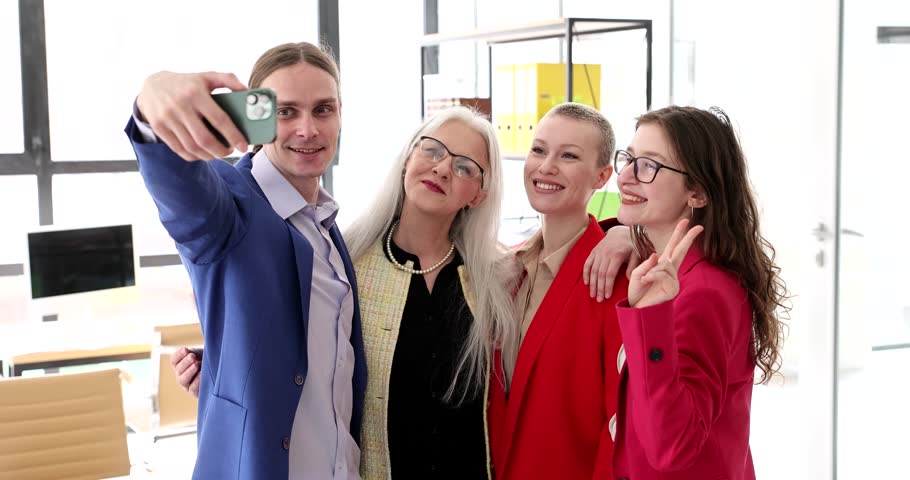 Team of business partners taking selfie on mobile phone in office 4k movie slow motion. Successful meeting of colleagues concept | Shutterstock HD Video #1111922185