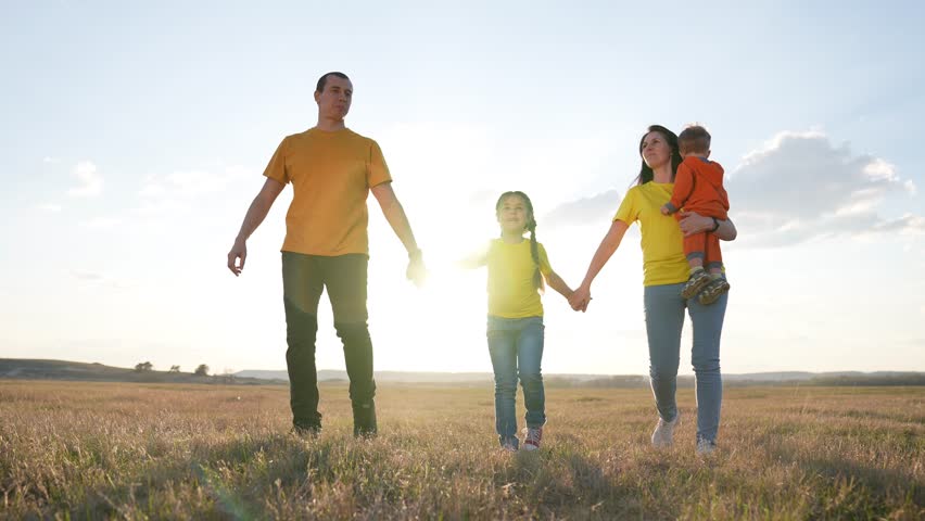 People are walking in park. Happy family walk of parents with children at sunset in sun. Family walk with children outdoors in park. Green family park. Family lifestyle of parents. | Shutterstock HD Video #1111922531