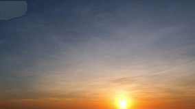 4K : Sunset sky timelapse, Captured in fast time-lapse, the fleeting beauty of a sunset sky with clouds unfolds as the sun vanishes. Summer sky background. Natural movement concept.
