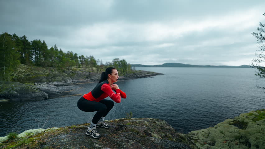 Sportswoman Doing Jumps At Top Of Mount, Training Outdoors In Open Air, Woman Keeping Fit