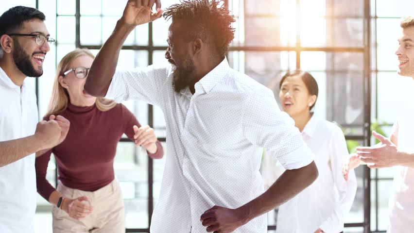 Best team ever. Portrait of extremely happy multinational coworkers are standing in office and screaming while expressing gladness. | Shutterstock HD Video #1111934349