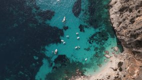 Aerial drone video of tropical paradise turquoise beach in Mediterranean Island of La Maddalena Archipelago, Costa Smeralda, Sardinia. Budelli, Spiaggia Rosa