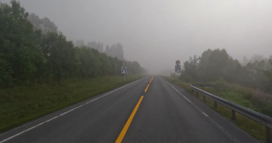 Fog on a Norway road. POV car trip. Vehicle point-of-view Driving a Car on a Road in Norway.