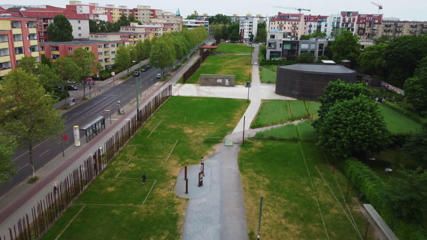 Forwards fly above Berlin Wall Memorial. Modern public place commemorating division of Berlin. Chapel of Reconciliation. Berlin, Germany