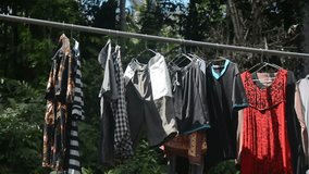 Some clothes are being dried under the hot sun