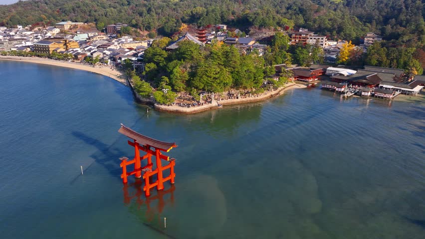 Japanese traditional red torii gate at sea, floating torii of Miyajima island in Hiroshima, tourism in Japan, Japanese culture. High quality 4k footage Royalty-Free Stock Footage #1111959189