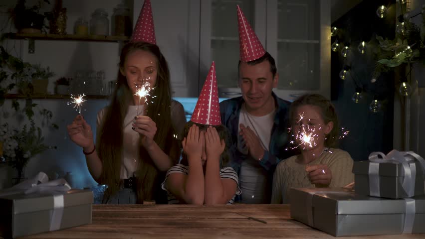 Happy family concept.big family holiday at home.birthday with family.celebration with cake and candles.emotions of joy at holiday.blowing out birthday candles.birthday at home.happy family on holiday