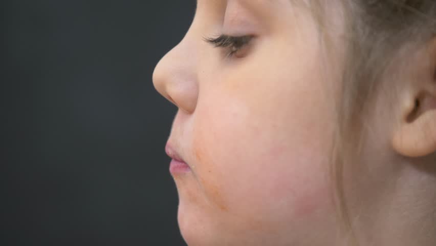 Happy family concept.child is sitting at the table at home. baby eats French fries from a box with his hands. baby