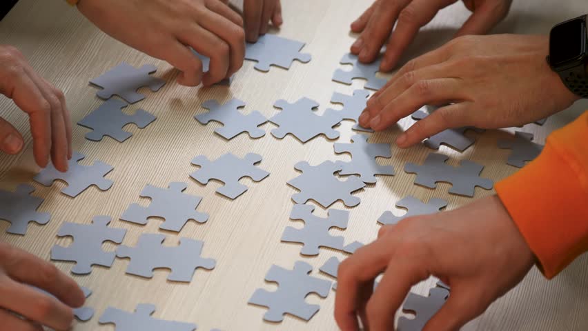Teamwork concept. cooperation of businessmen.people put puzzle pieces together.team business.team collaboration.businessmen working together.group of people cooperate.business solution.success in team Royalty-Free Stock Footage #1111963171