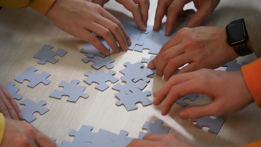Teamwork concept. cooperation of businessmen.people put puzzle pieces together.team business.team collaboration.businessmen working together.group of people cooperate.business solution.success in team | Shutterstock HD Video #1111963171