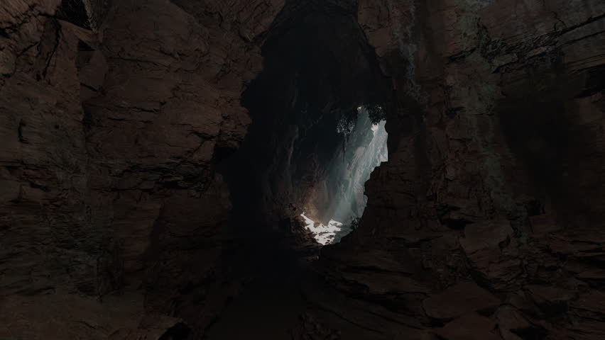 A cave entrance with a waterfall coming out of it Royalty-Free Stock Footage #1111963695
