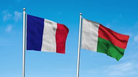 France and Madagascar Flag waving in sky. High detailed waving flag of France and Madagascar. Flag of France and Madagascar. 3D Render. Waving in sky.