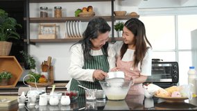 Woman her older mom prepare together dough for homemade pastries 