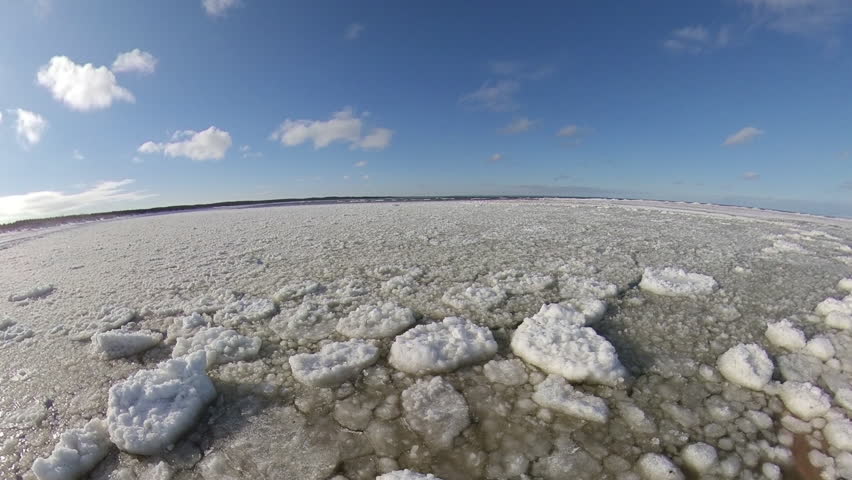 Ice floes and Icebergs on Frozen Baltic Sea in Poland on Sunny Day | Shutterstock HD Video #1111972709