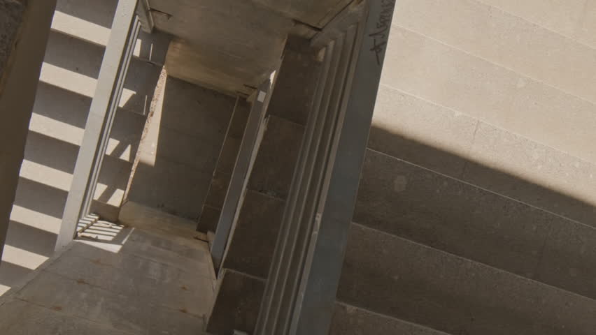 From above vertical shot of young skilled man doing parkour jumps on concrete construction site | Shutterstock HD Video #1111975181