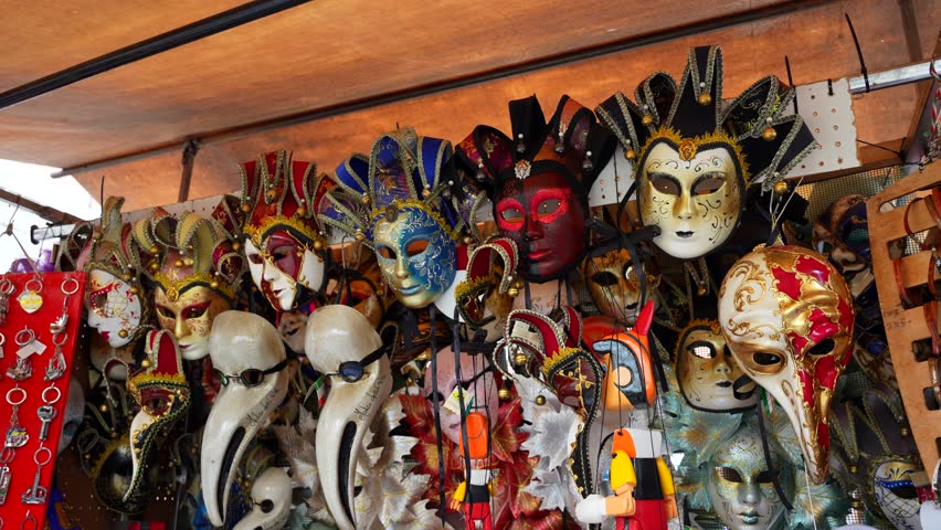 Tilt-down of souvenir shop items including Venetian masks, Rialto market | Shutterstock HD Video #1111977187