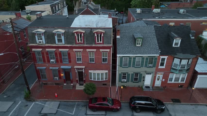 Inner city homes in America urban center. Aerial view of row houses at night.