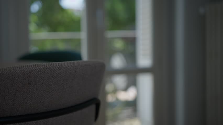 Blurred Image Of A Person Walking Inside Her Room To The Balcony. - selective focus shot