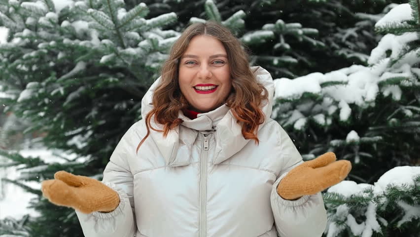 Portrait of happy beautiful woman, young joyful positive woman walking playing with snow, snowflakes, having fun outdoors. Winter season, weather. High quality FullHD footage | Shutterstock HD Video #1111985845