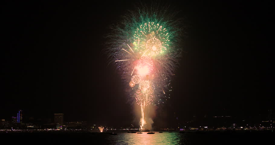 Celebration greeting Beautiful fireworks colorful fireworks on the beach for abstract background , anniversary, celebration , 4th independence day and new year background or wallpaper. | Shutterstock HD Video #1111985989