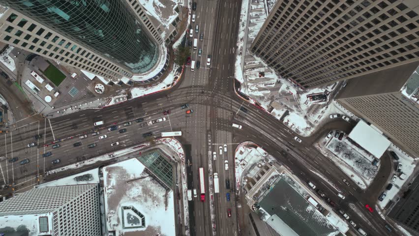Cinematic Overhead Vehicle Traffic 4K Time lapse Winter Drone Shot Canadian Roadway Trans Highway One Intersection Portage Avenue and Main Street Capital City Downtown Winnipeg Manitoba Canada | Shutterstock HD Video #1111988451