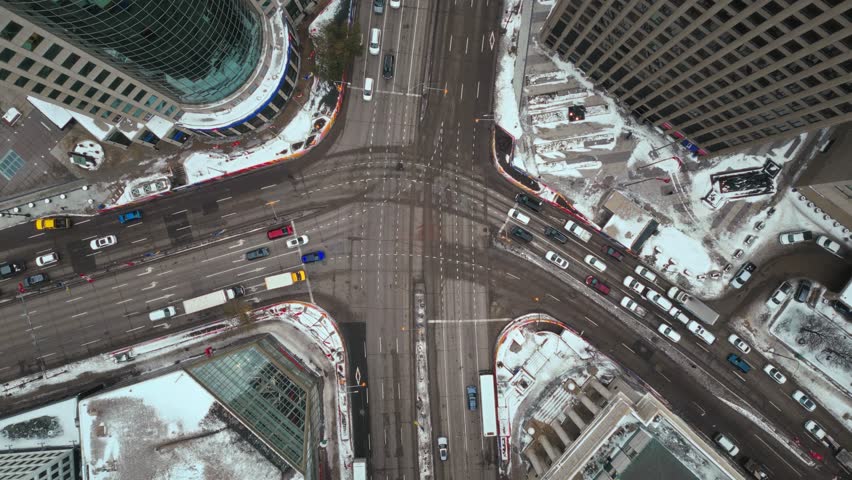Overhead Vehicle Traffic 4K Hyper Time lapse Winter Drone Shot Canadian Roadway Trans Highway One Intersection Portage Avenue and Main Street Capital City Downtown Winnipeg Manitoba Canada | Shutterstock HD Video #1111988505