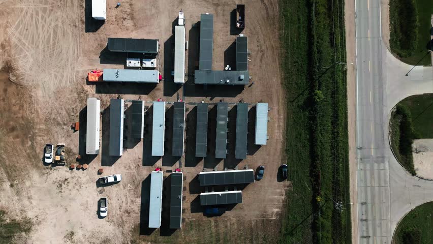 Overhead 4K Time Lapse Group of a Workplace Exterior Housing Job Site Temporary Construction Forman Portable Site Prefabricated Mobility Trailers Next to Busy Road Cars and Traffic | Shutterstock HD Video #1111988541