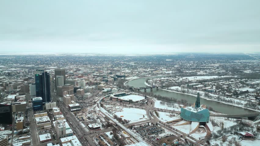 Establishing Wide Angle Shot Full Canadian Museum of Human Rights Urban Winnipeg Manitoba Canada Downtown Skyscraper Buildings City Overcast Landscape Skyline Snowing Winter Drone 4k Shot Static View | Shutterstock HD Video #1111988647