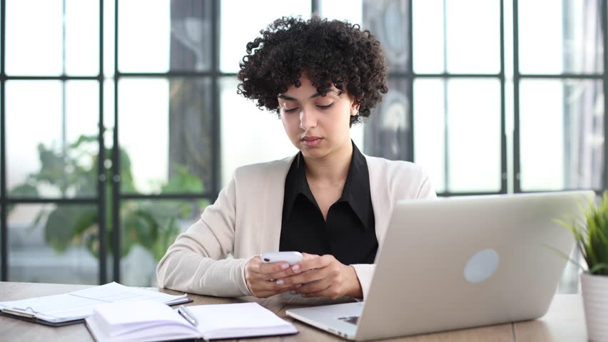 Portrait of Young Successful Caucasian Businesswoman Sitting at Desk Working on Laptop | Shutterstock HD Video #1111991249