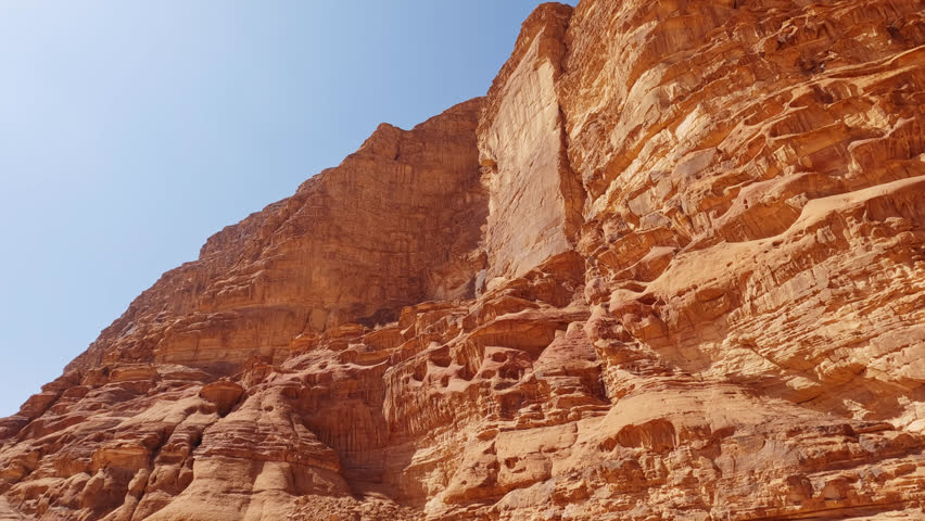 Close up tilt up shot of beautiful rock formation in Wadi Rum, Jordan | Shutterstock HD Video #1111993041
