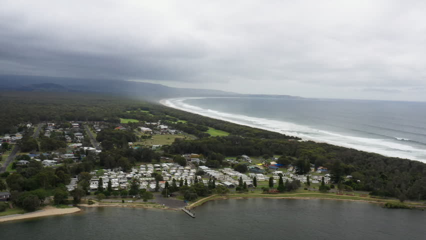 Aerial drone shot around Shoalhaven heads and caravan park on a stormy day in south coast NSW, Australia | Shutterstock HD Video #1111999637