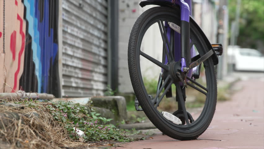A hire bike stands on a quiet urban residential street, innerwest Sydney Australia. Close up