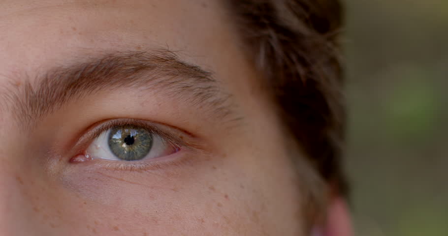It's as if the person is inviting you to look deep into soul. Symbol of identity eye close up. Close-up of grey eye can create a sense of intimacy and connection between the viewer and the subject.  Royalty-Free Stock Footage #1112007313
