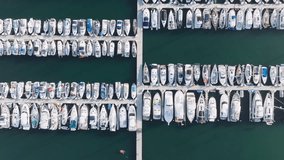 Birds eye view of Santa Barbara city Harbor at Pacific coast, California, USA. Top shot of luxury boats and motorboats docked in the marina. Aerial view on the port from Point Castillo, 4k footage