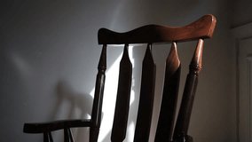 Wooden rocking chair moving in the room - Powered by Shutterstock - Get 15% off with code: PIKWIZARD15