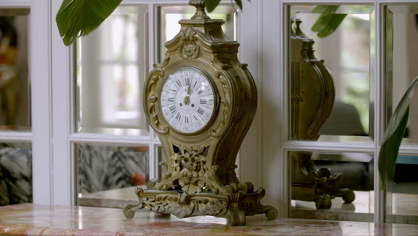 Antique gilt clock with baroque embellishments France