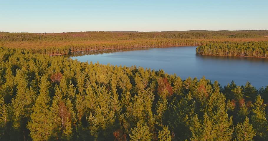 Aerial view of landscape at Komio Nature Reserve with lake luutalammi in sunny autumn weather, Loppi, Finland.