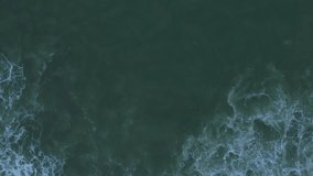 Beach and waves with aerial view from drone. Sea and ocean landscape.