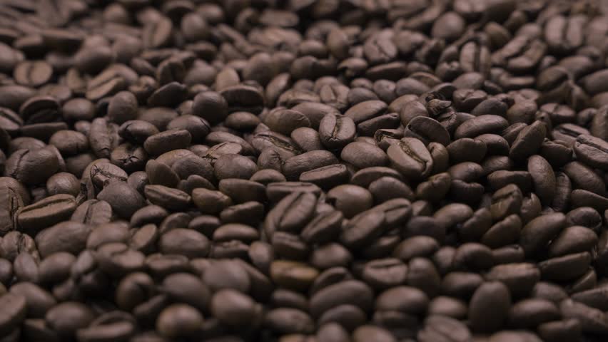 Footage of brown coffee beans in motion. | Shutterstock HD Video #1112027541