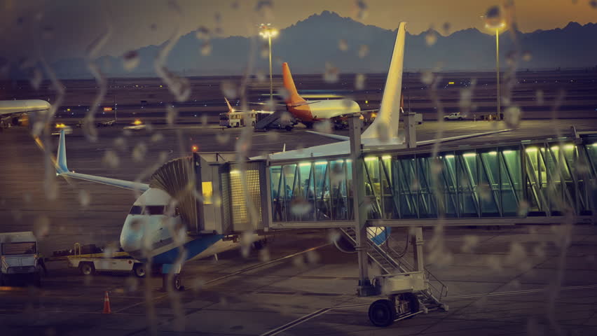 Time Lapse vehicles and workers refilling, loading cargo in to airplane at the airport in the rain. Logistic transportation | Shutterstock HD Video #1112028189