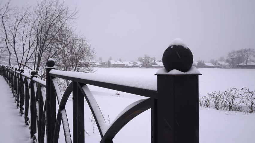 public park. public park in winter.iron fence in the park. slow motion video. High-quality shooting in 4K format.