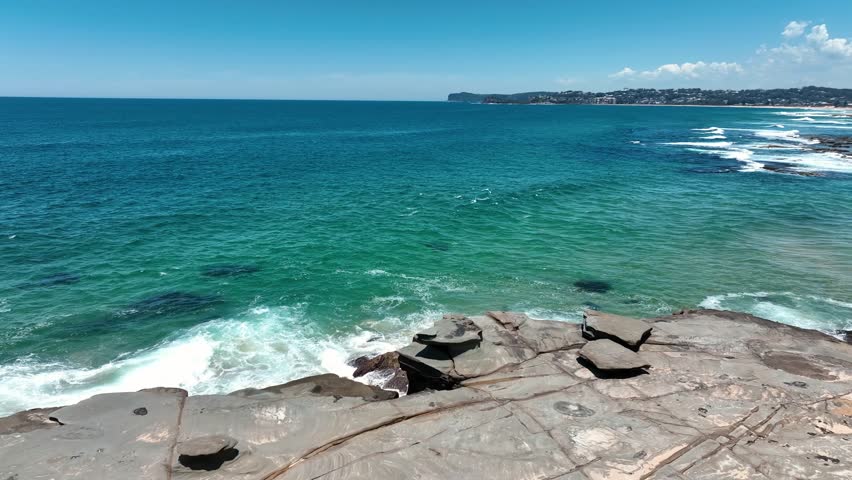 Aerial Mastery: Spoon Bay's Rocky Coastline Beside Wamberal Beach, Central Coast's Nature Reserve, New South Wales, Australia Royalty-Free Stock Footage #1112030327