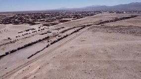 Cemetery of trains in Uyuni region, Salar de Uyuni, Bolivia, with 4k aerial drone footage.